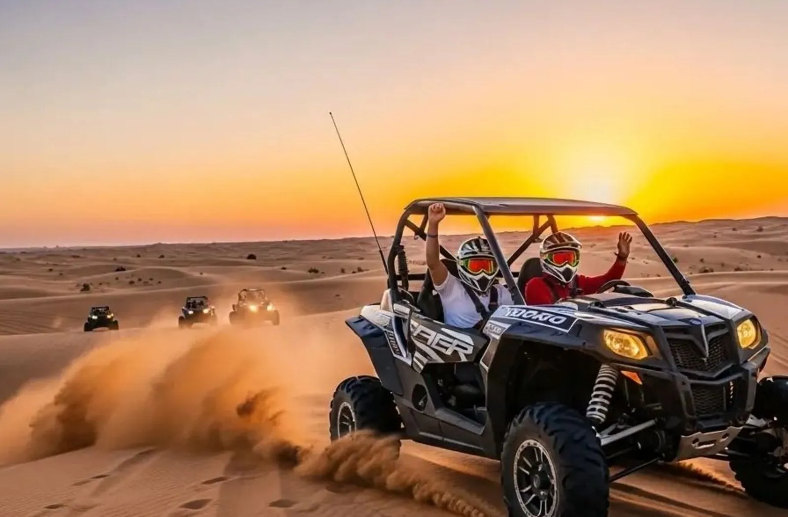 Guests enjoying a thrilling dune buggy ride across the sand dunes during a premium desert safari in Dubai.