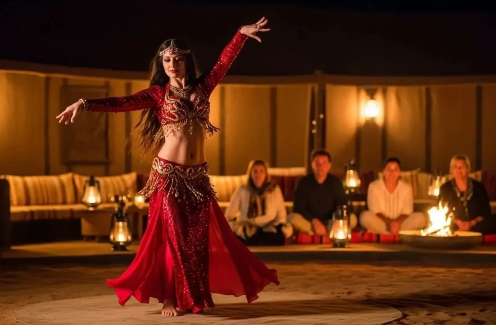 Guests enjoying a live belly dance show during an evening desert safari in Dubai.